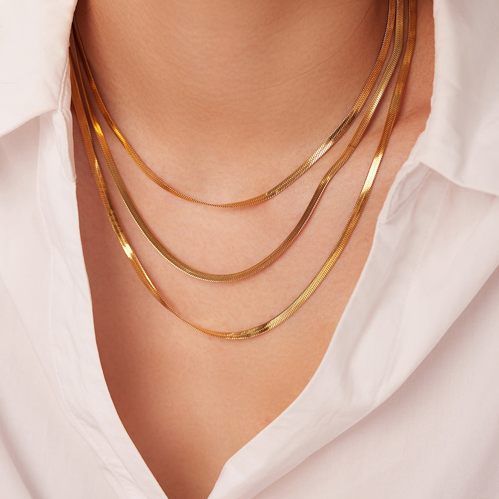 Sophie – A delicate gold necklace with multiple layers.
