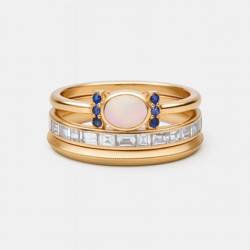 Teresa – A gold ring with a radiant opal and clear contours.