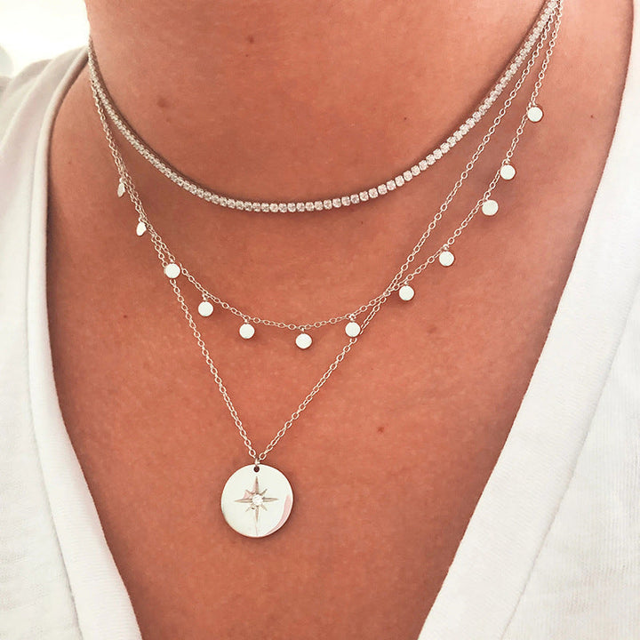 Sophie – A silver necklace with multiple layers and a modest pendant shape.