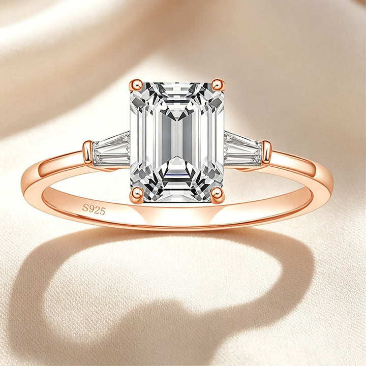 Emerald-cut three-stone ring